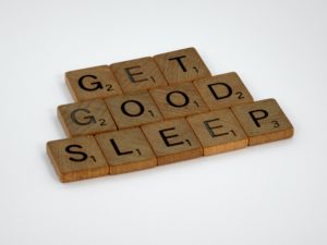 Decorative image showing scrabble tiles spelling out get good sleep